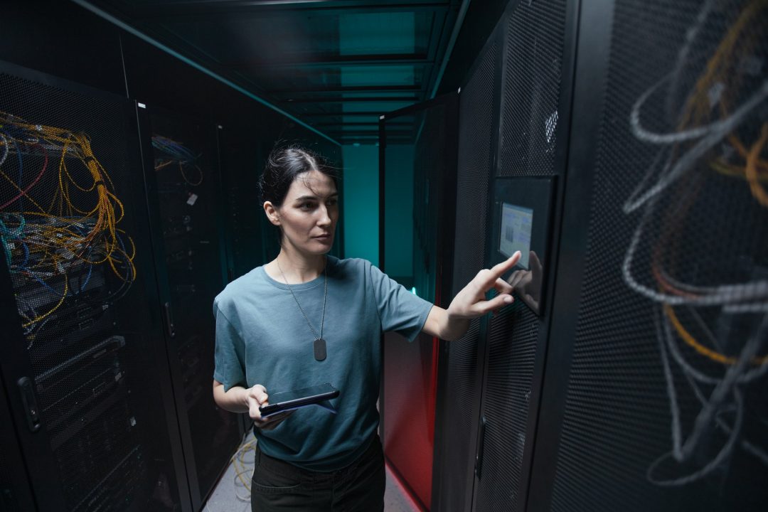 Woman Managing Server in Data Center